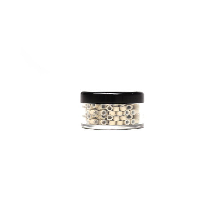 A jar containing 250 small white beads for beaded extensions, each measuring 5 mm, against a white background.
