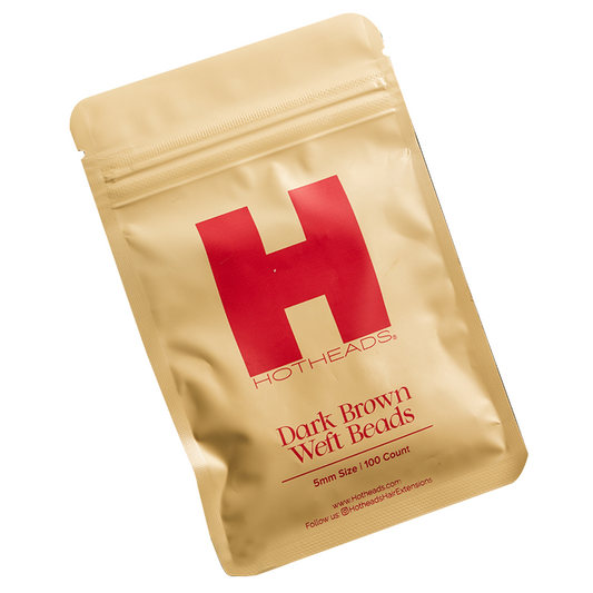 A packet of dark brown weft beads by Hotheads, designed for hair extensions, featuring a peach color accent.